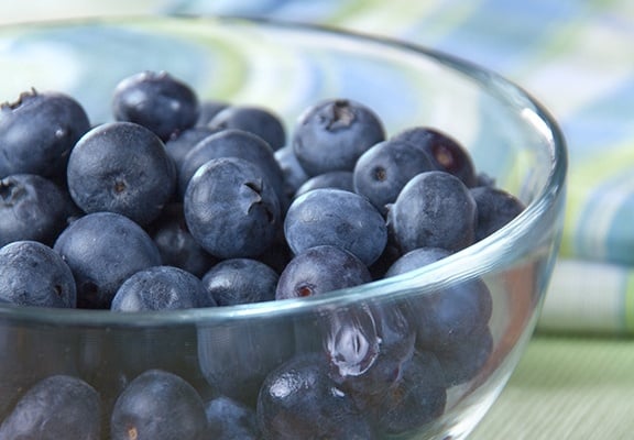 Blueberries make a perfect water background for aquatic sandwich shapes like sharks, dolphins or boats.