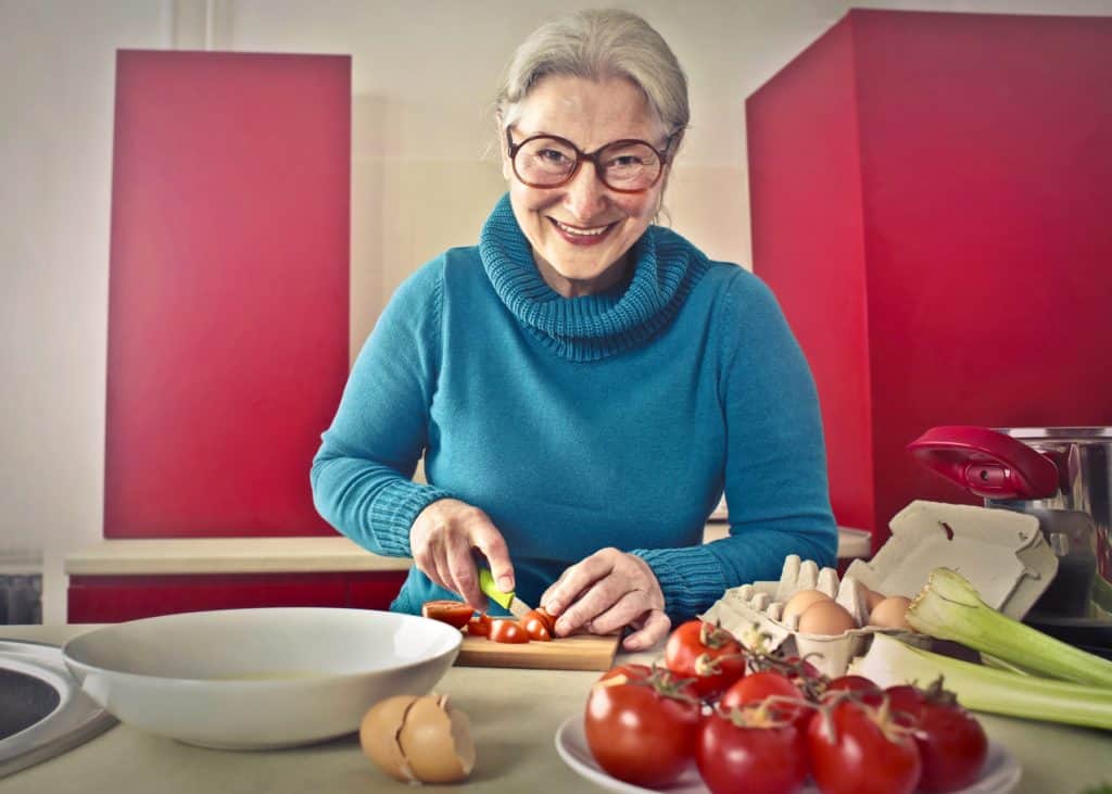 Elderly woman cooking
