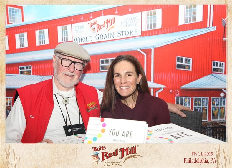 Allison Stowell poses with Bob of Bob's Red Mill