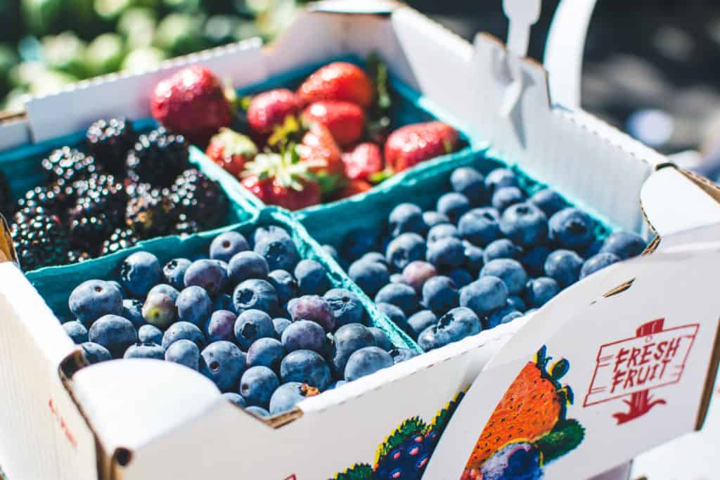 Blueberries and other berries at a farmers market