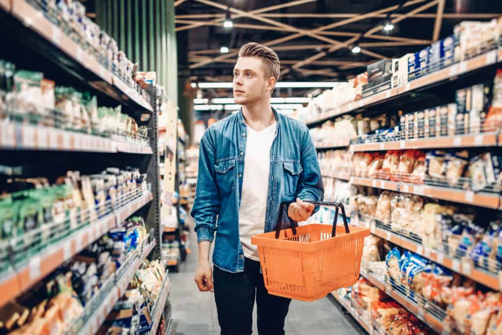 young man in supermarket