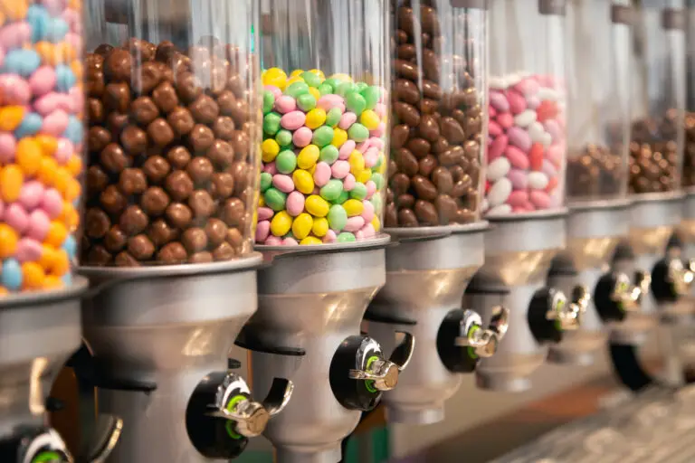 Bright candies in containers by weight in a candy store