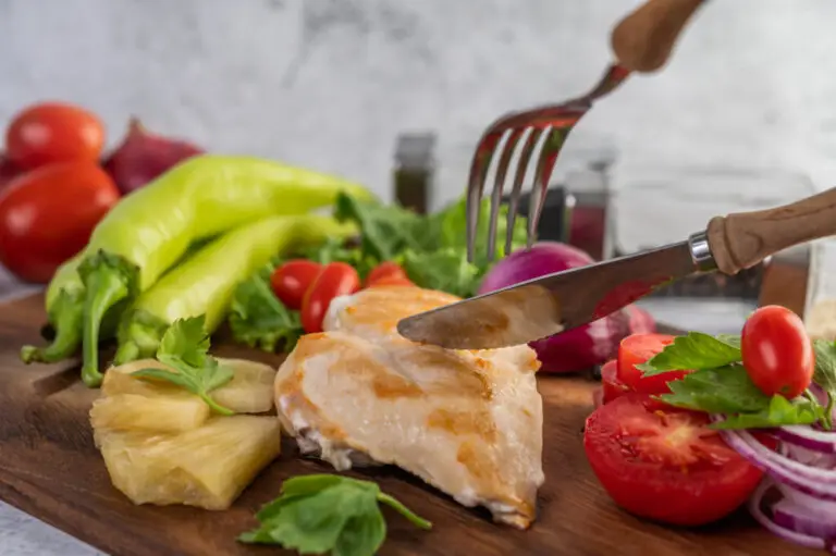 Chicken steak placed on a wooden tray